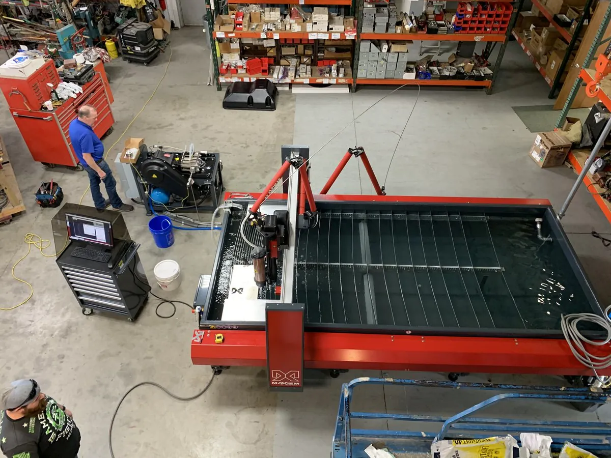 OMAX MAXIEM 1530 abrasive waterjet cutting steel at Tri-State Signs